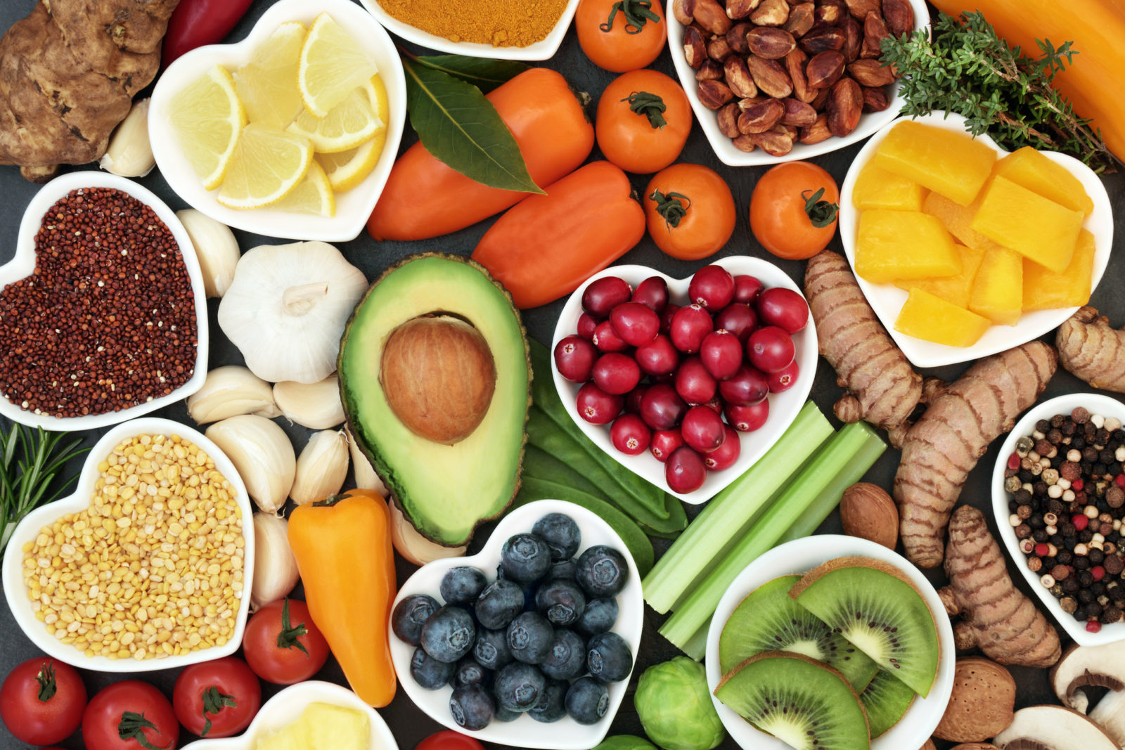 An assortment of heart-healthy foods, including many in heart-shaped bowls