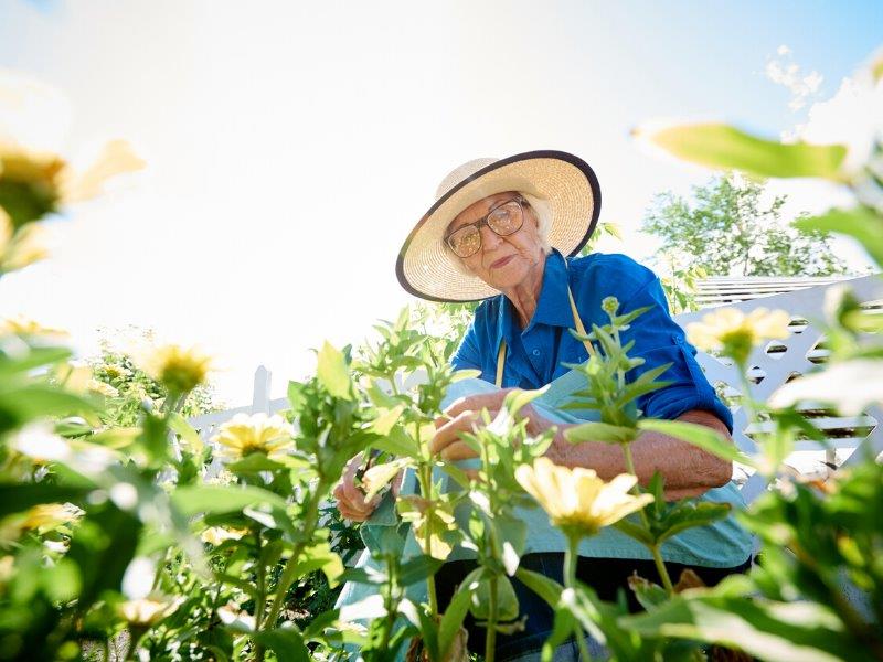 Senior woman outside wearing sunhat